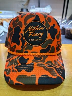 NUTHIN FANCY Orange Camo Trucker Hat.